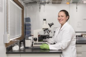 girl in lab coat - Economic Development Commission