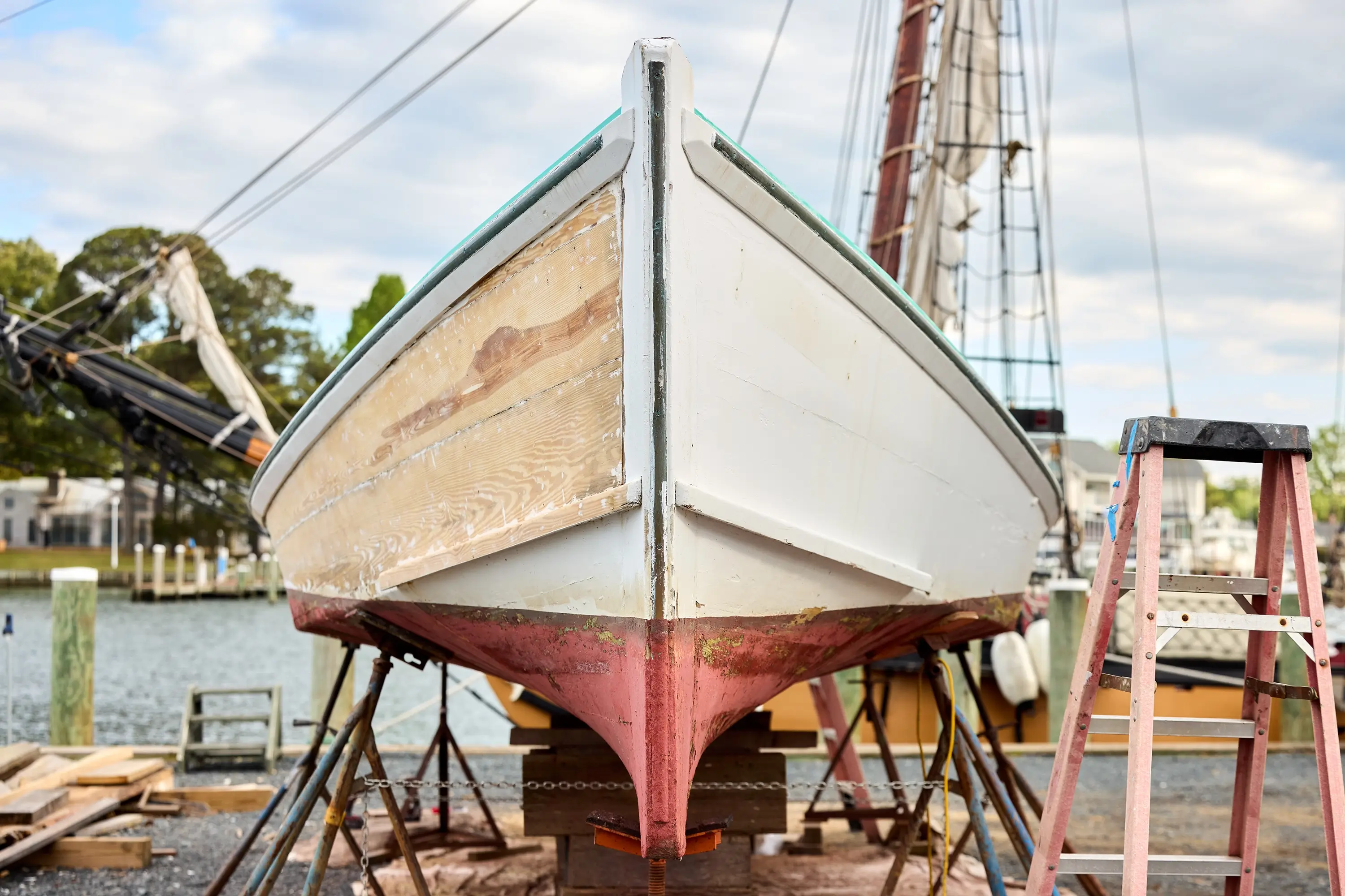 A boat being painted on one side