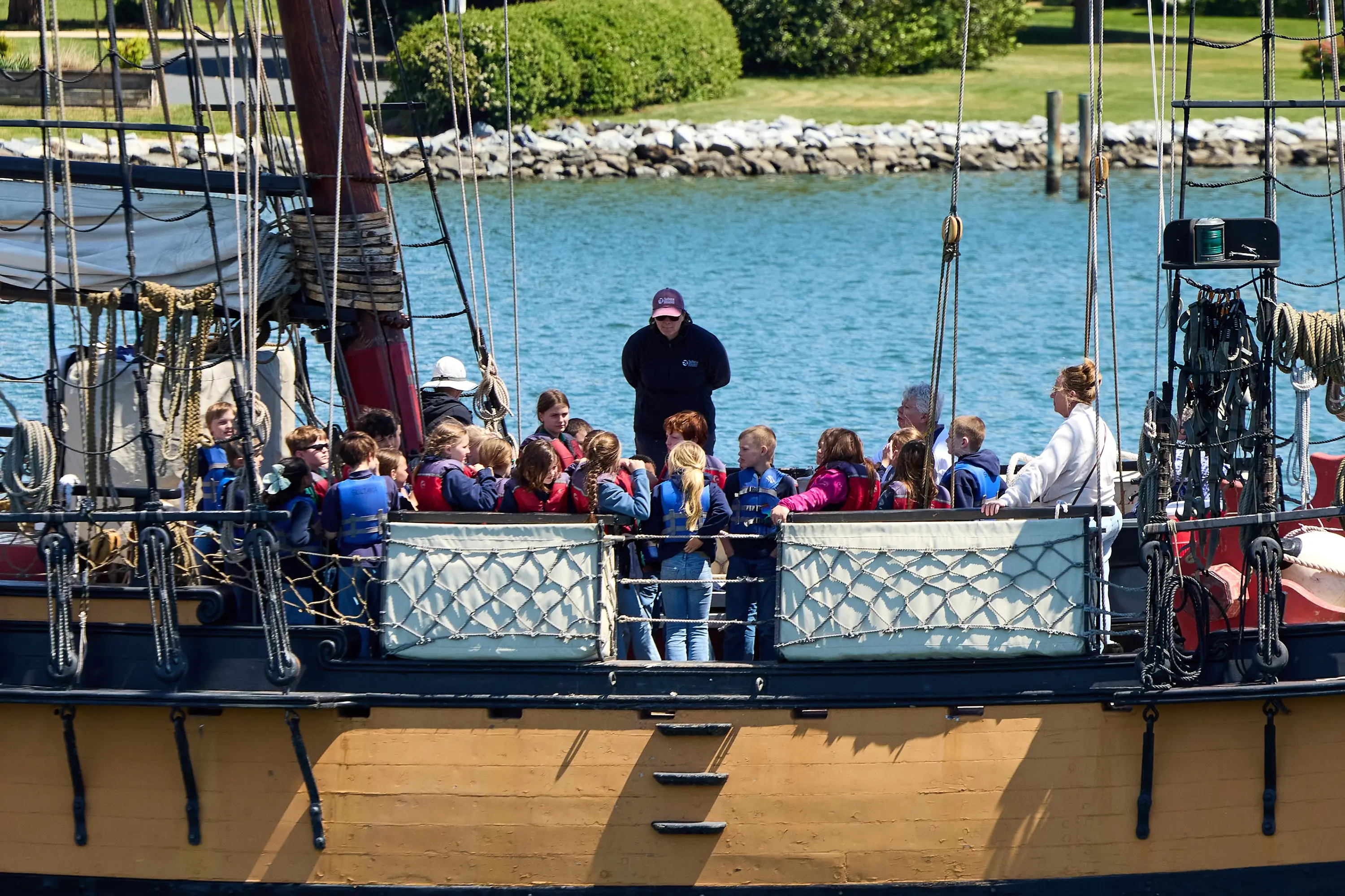 A group of school kids on a boat